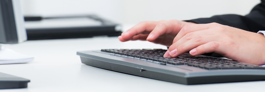 man typing on a computer keyboard man typing on a computer keyboard
